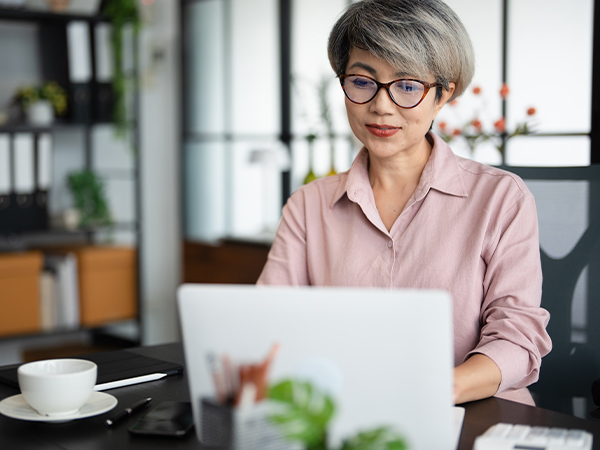 Asian-woman-working-on-laptop-at-home