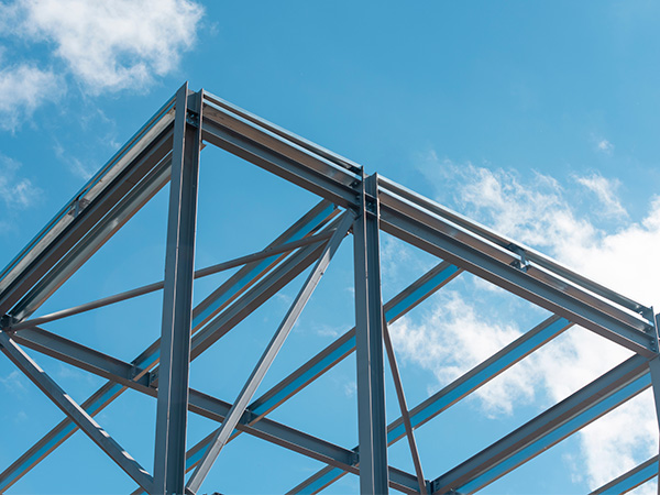 Steel Frame Construction Under Blue Sky