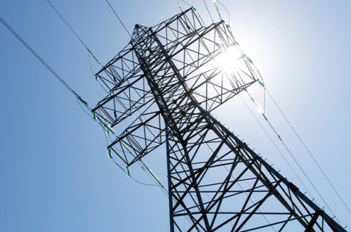 A-tall-power-tower-with-wires-and-a-clear-blue-sky