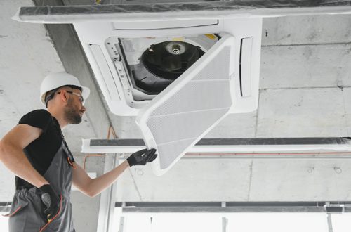 Male-Technician-Repairing-Air-Vent