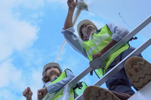 Male-and-female-electric-turbine-engineers-discussing