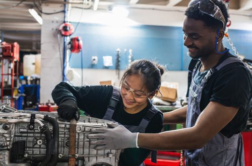 two-engineering-students-working-on-motor